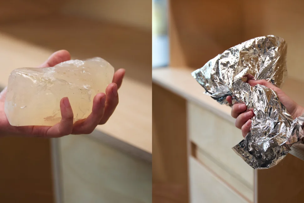 This image is two different photographs shown together. On the left is a close-up of someone's hand holding a piece of white-yellow rock with a waxy-like finish. The rock is large, and sits in the entire palm of the persons hand. The right-hand image is a close-up of someone holding a wrinkled aluminium sheet which is larger than their hand. The person is wearing a silver watch and has a long-sleeved black shirt on.