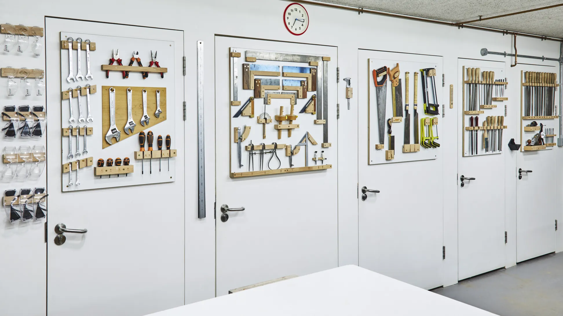 A 5 meter wall covered in tools, arranged neatly and nested in custom made holders.
