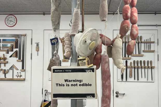 Strings of sausage made from fabric hanging from the ceiling