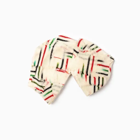 Broken ceramic fragments mended with textile and glue