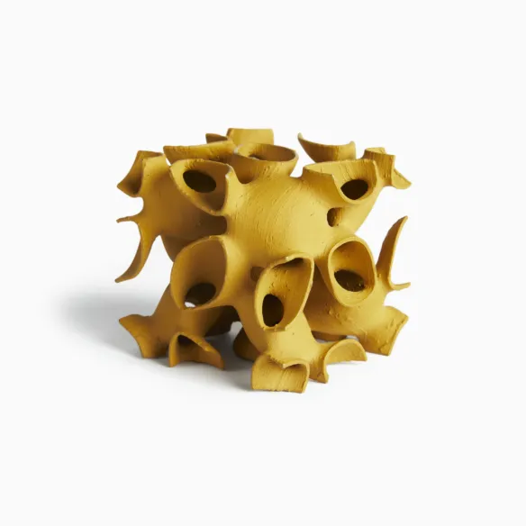 Beige 3D printed cube with complex geometry