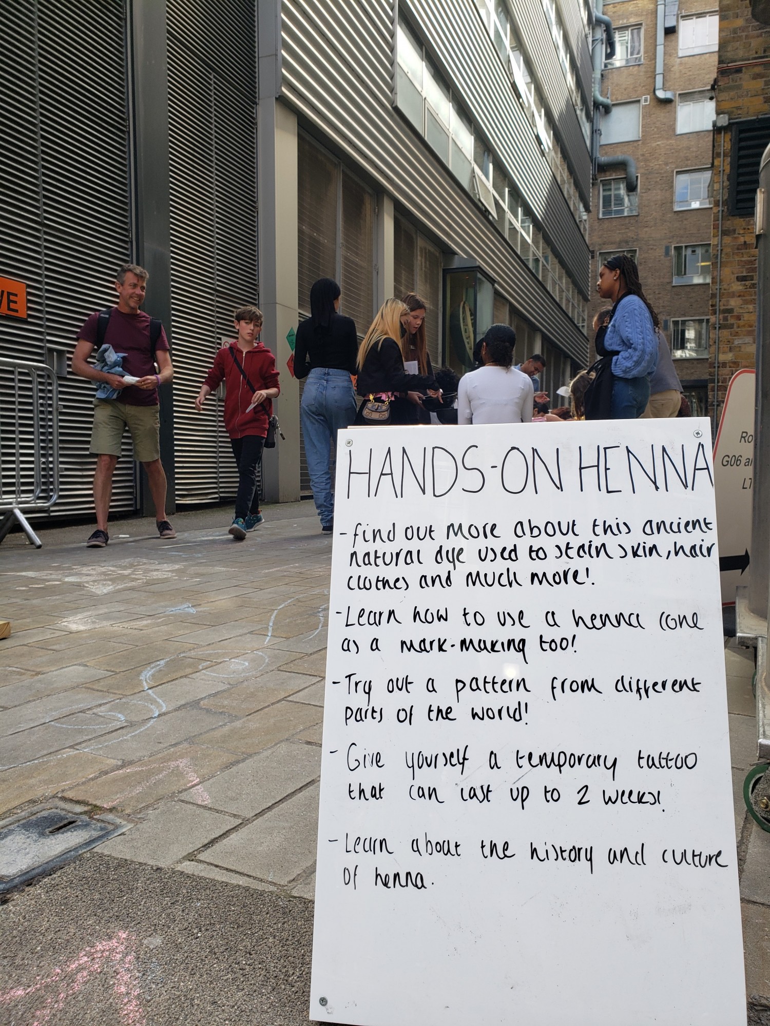 A board explaining the group's henna stall at the Festival of Stuff