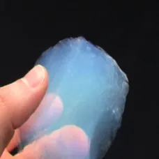 Hand holding large lump of aerogel