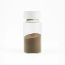 Small glass jar of copper powder